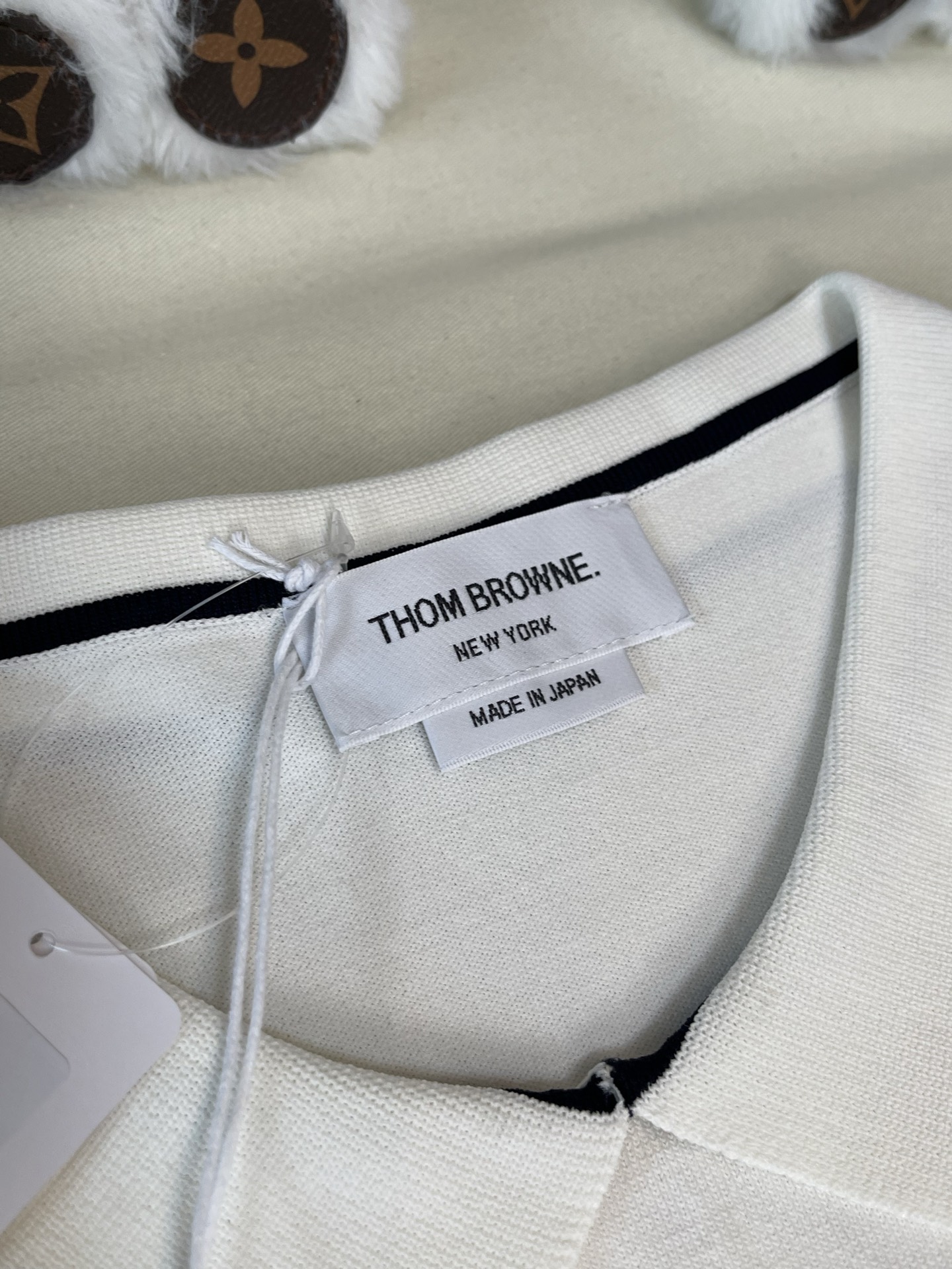 Contrast-Trim Sleeveless Zip Polo — product photograph