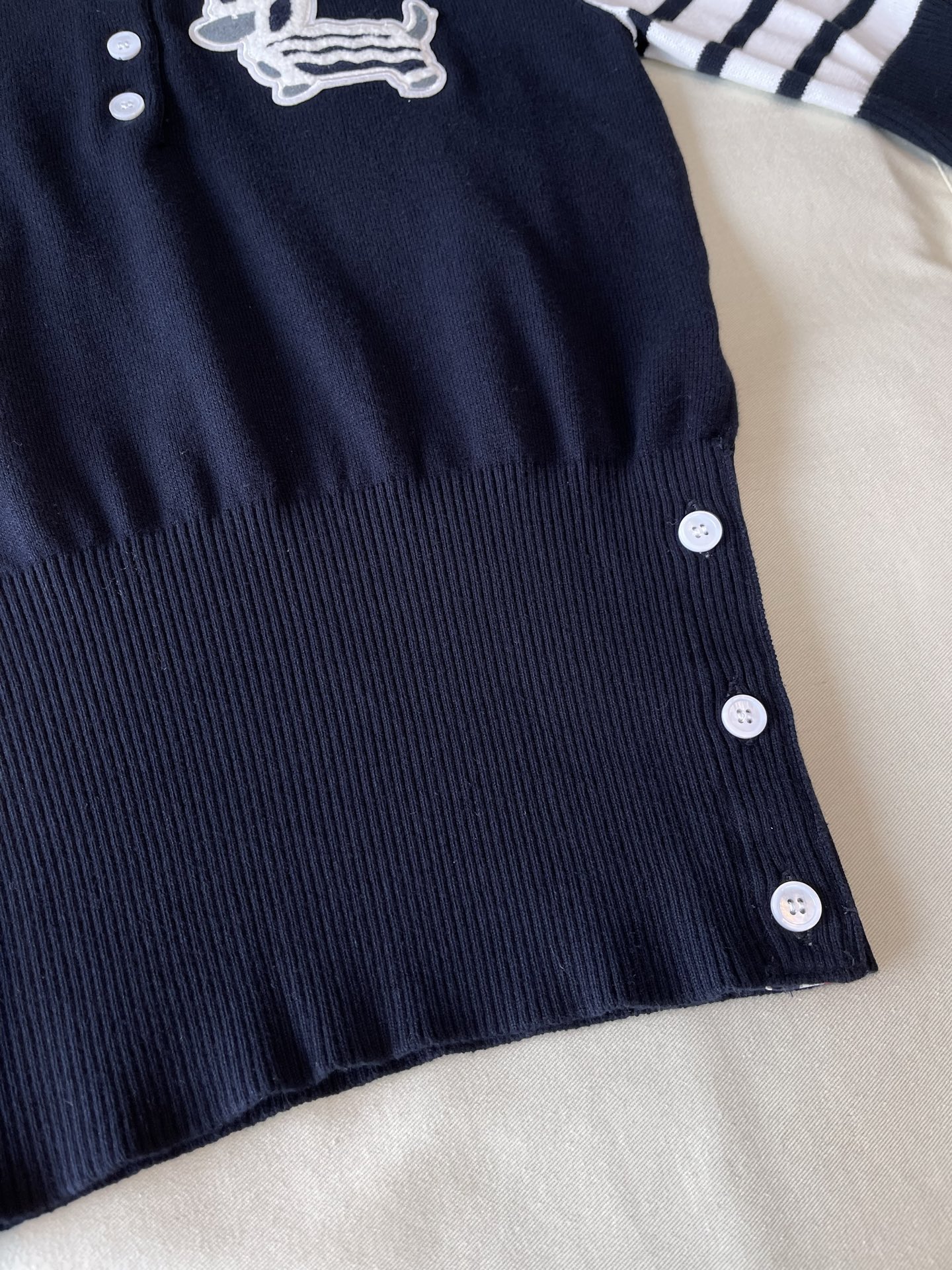 Dachshund Crest Four-Bar Knit Polo — product photograph