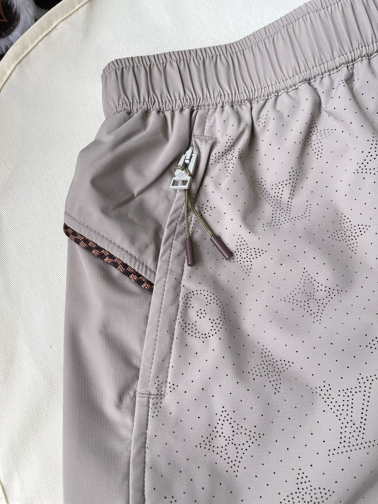 Perforated Logo Drawstring Shorts — product photograph