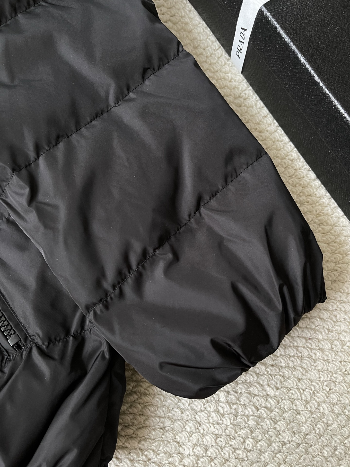 Triangle-Badge Zip-Pocket Puffer — product photograph