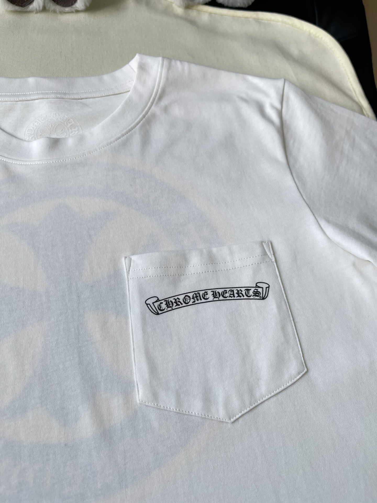Circle Cross Back-Print Pocket T-Shirt — product photograph