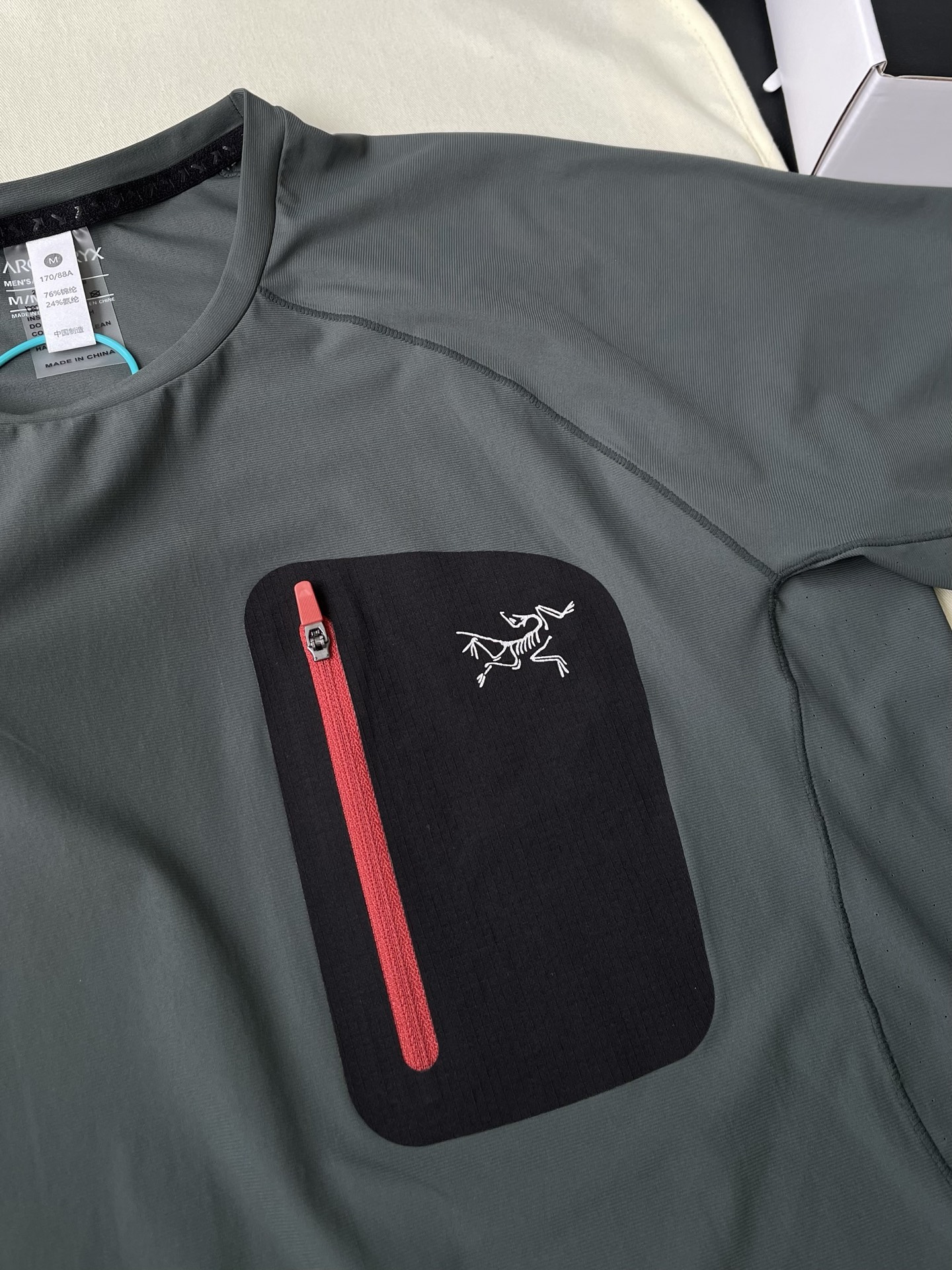 Contrast Zip-Pocket Raglan T-Shirt — product photograph