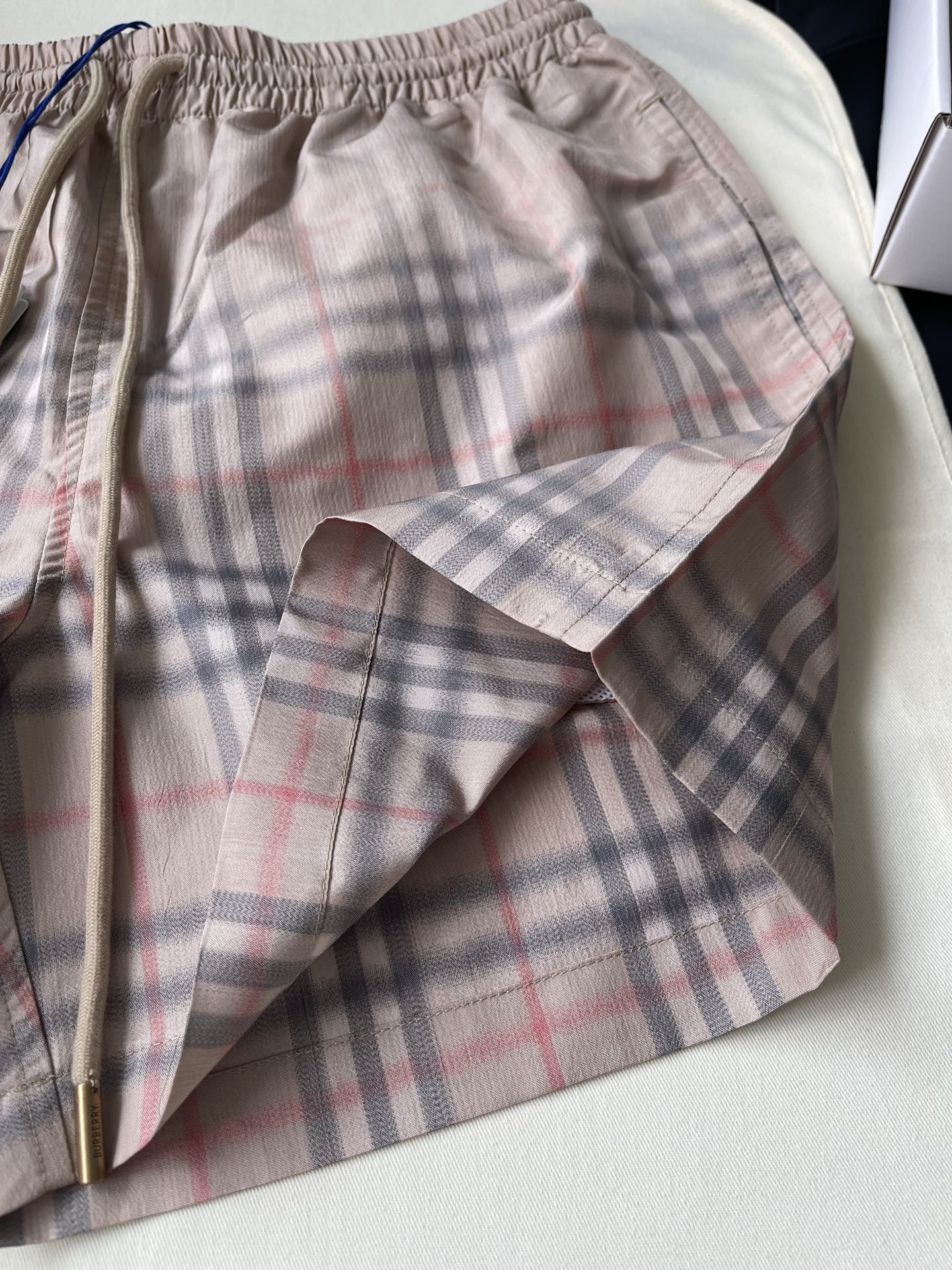 Pale Check Drawstring Shorts — product photograph