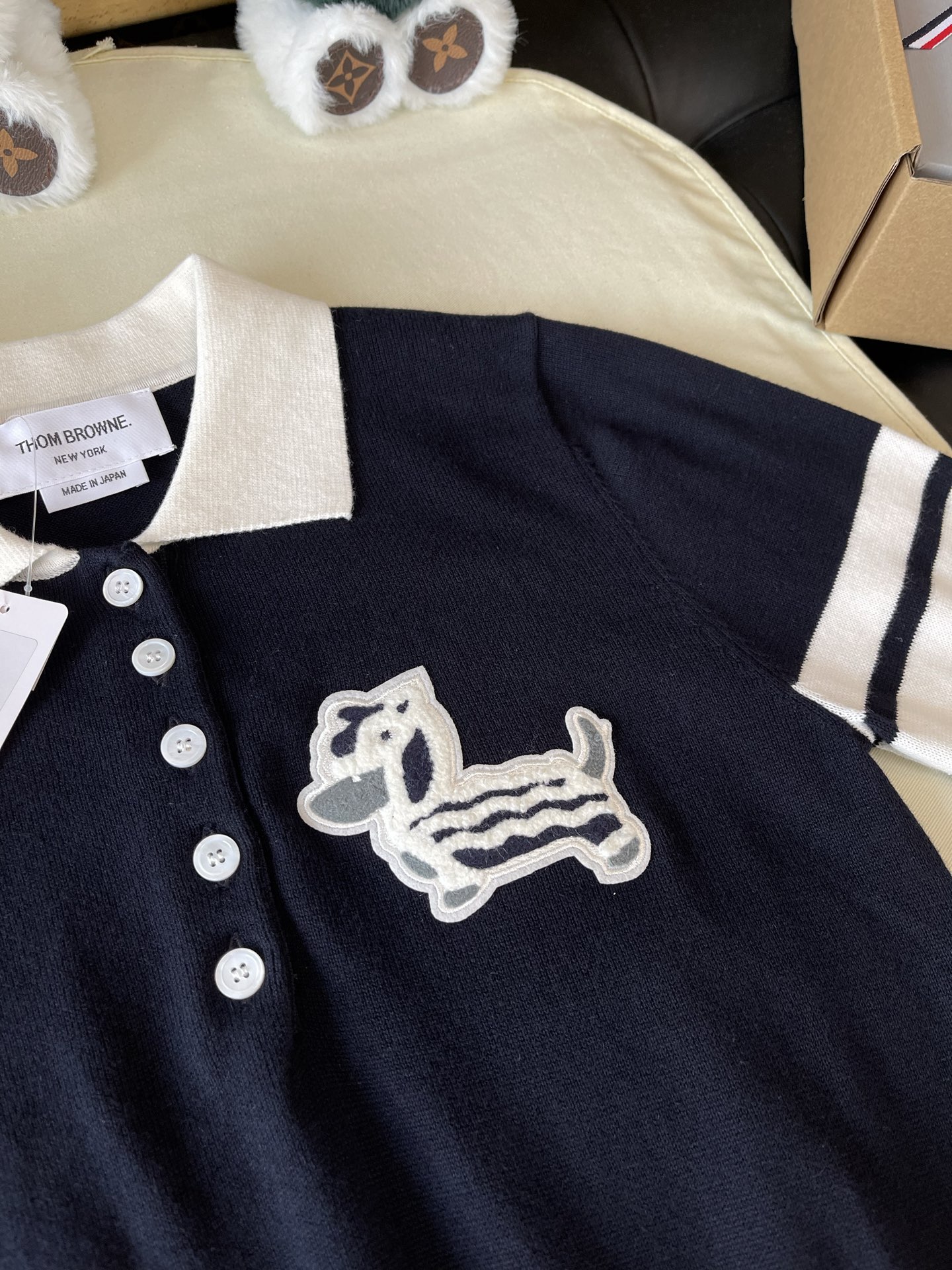 Dachshund Crest Four-Bar Knit Polo — product photograph