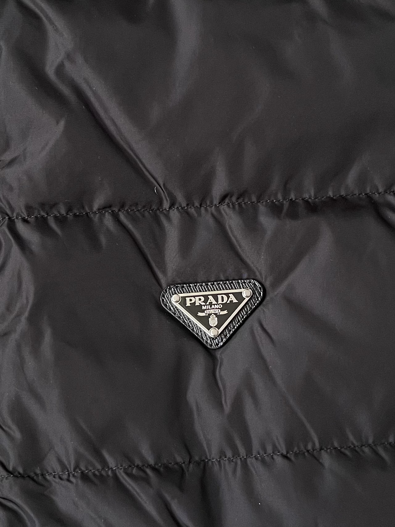 Triangle-Badge Zip-Pocket Puffer — product photograph