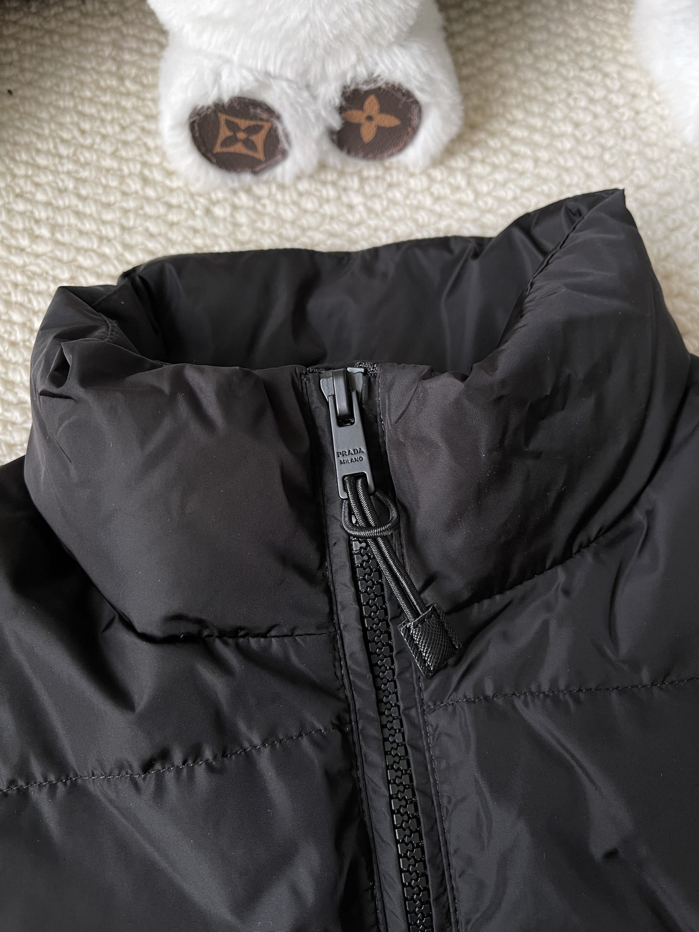 Triangle-Badge Zip-Pocket Puffer — product photograph