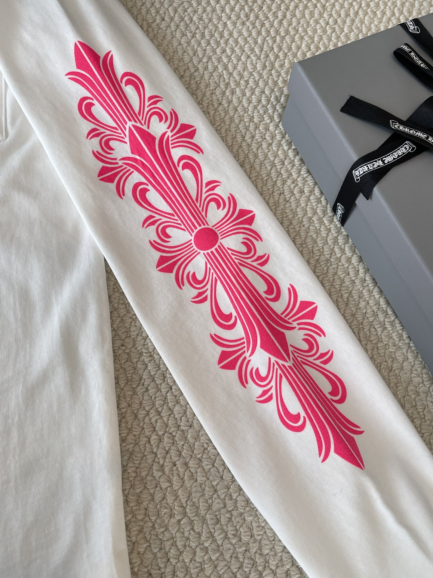 Pink Floral-Sleeve Horseshoe T-Shirt — product photograph