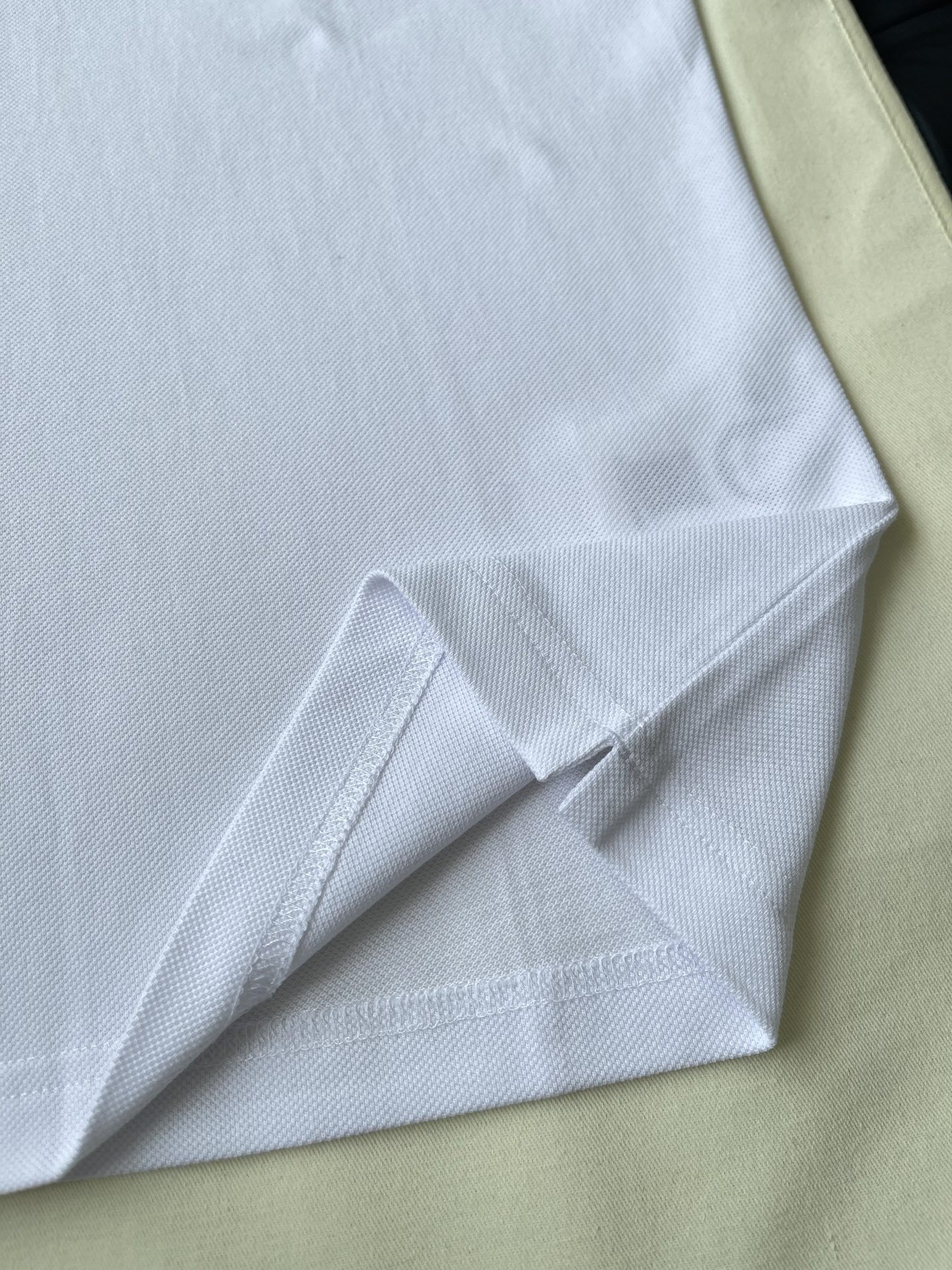 Stripe-Sleeve Badge Polo — product photograph