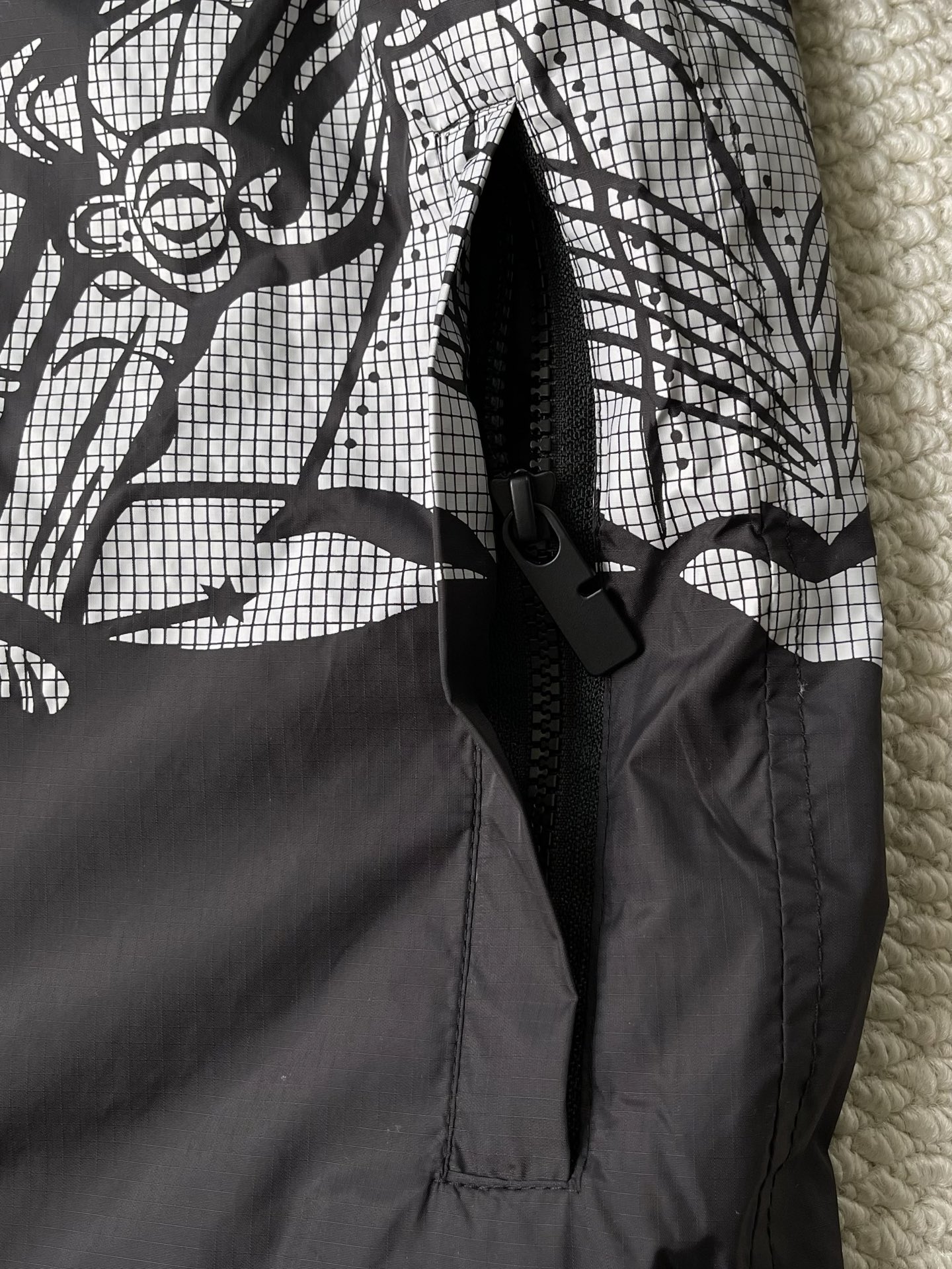 Large-Crest Graphic Windbreaker — product photograph