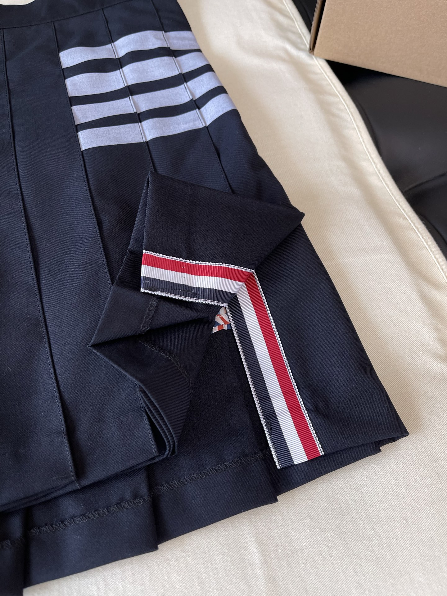 Four-Bar Layered Pleated Skirt — product photograph