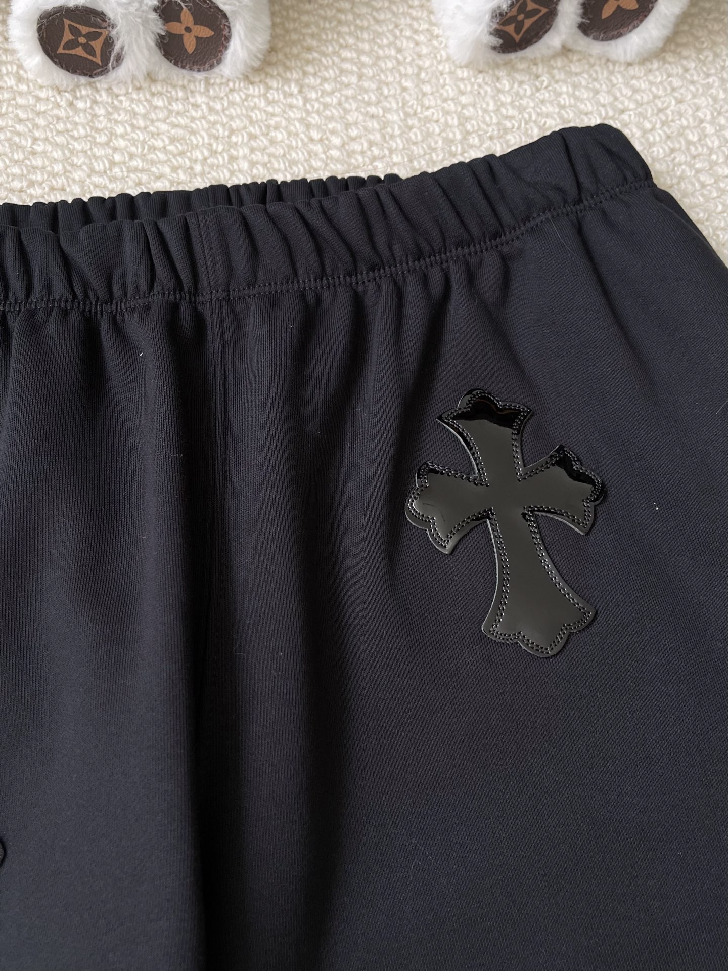 Cross-Motif Drawstring Trousers — product photograph