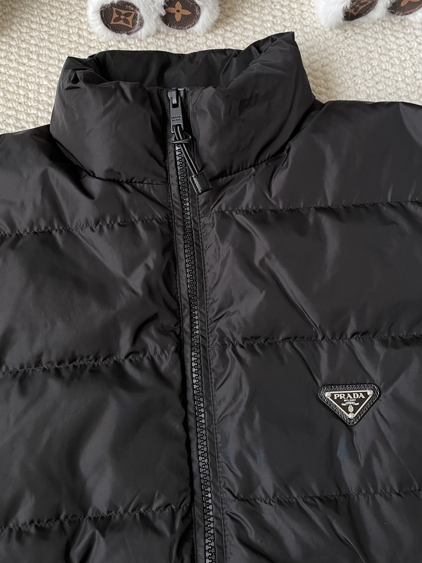Triangle-Badge Zip-Pocket Puffer — product photograph
